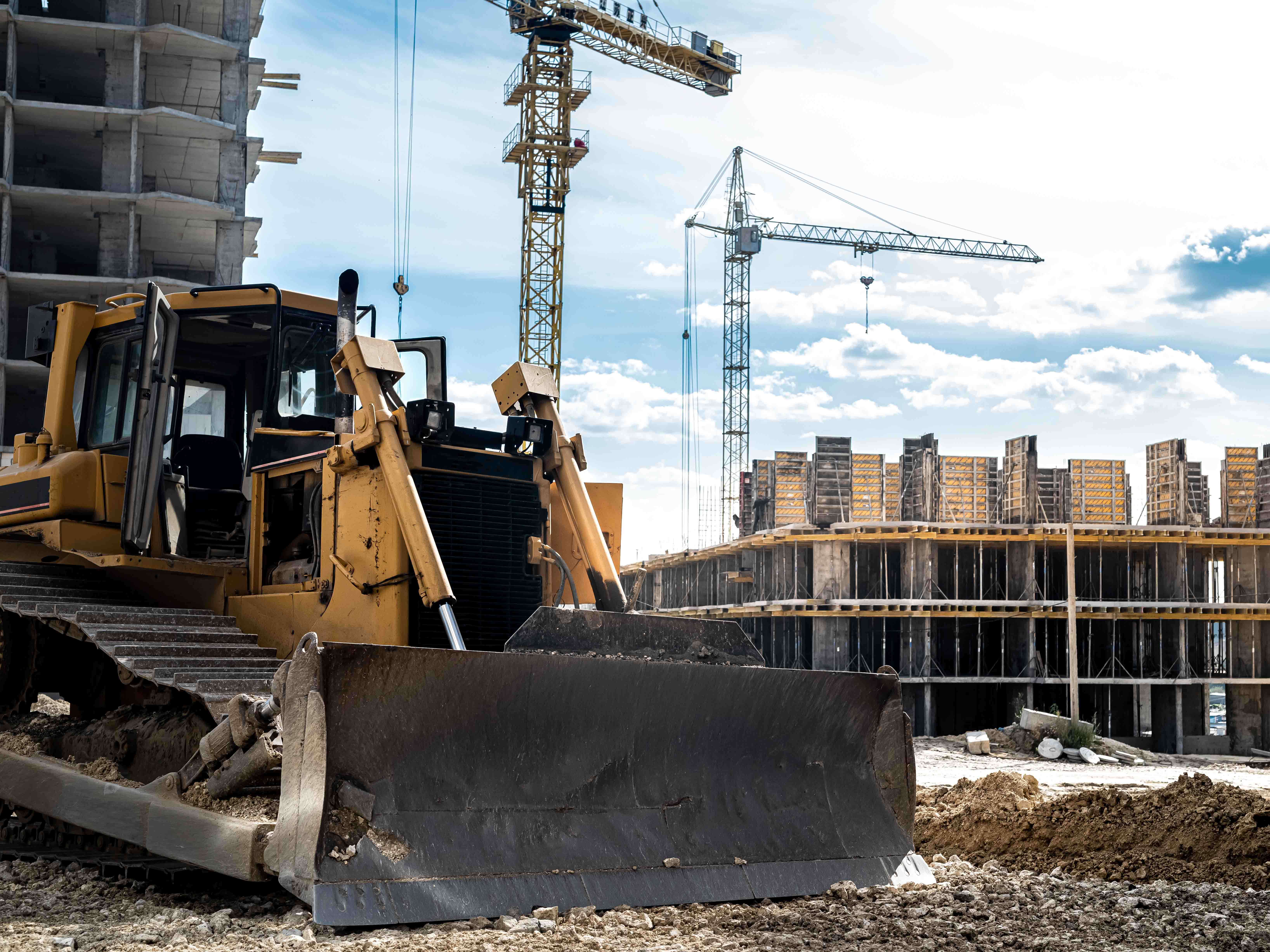 under construction on a background of blue sky and new buildings